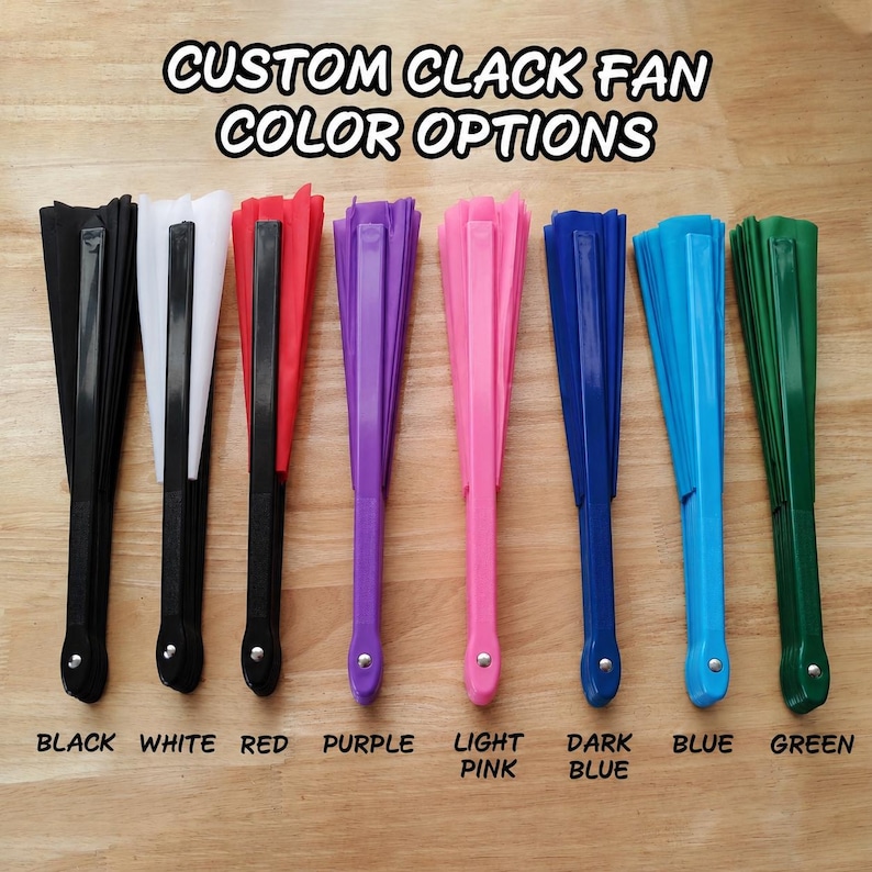 May include: Eight folding hand fans arranged in a row, each with a solid color handle and fabric. The text CUSTOM CLACK FAN COLOR OPTIONS appears at the top, with labels for black, white, red, purple, light pink, dark blue, blue, and green below.