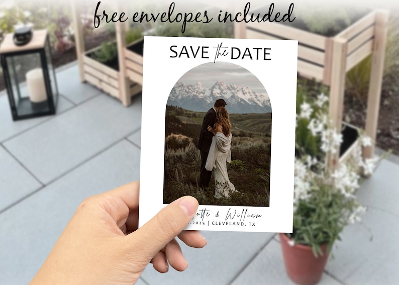 May include: Save the Date card featuring a photograph of a couple in front of a mountain range. The card text reads "Save the Date" and includes the couple's names, date, and location.