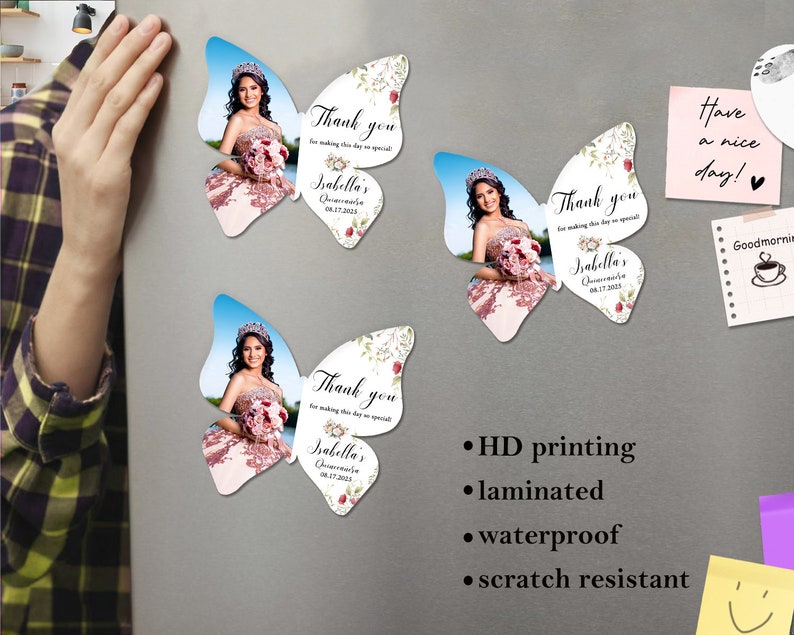 May include: Three butterfly-shaped magnets with a photo of a young woman in a quincea&ntilde;era dress. The magnets have a floral design and the text "Thank you for making this day so special Isabella's Quincea&ntilde;era 08.17.2023".