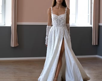 A-linjeformad brudklänning i spets: Långärmad brudklänning med 3D-blommor