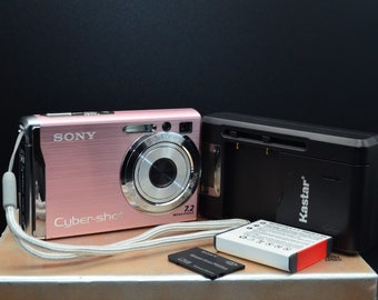 Like new Pink Sony Cybershot DSC-W80 7MP digital camera with new battery,new charger and a 2Gb Sony Memory stick pro duo option. Working