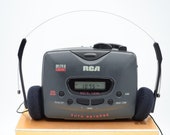Serviced RCA stereo cassette player AM FM radio with bass boost. New belt. Fully tested and working. Batteries and headphones included.