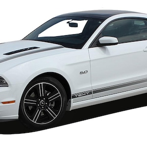 May include: White Ford Mustang with black racing stripes and a black spoiler. The car has black wheels and a black interior. The car has the text "5.0" and "TEXT" on the side.