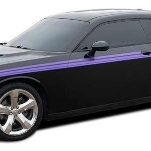 May include: A black Dodge Challenger with purple racing stripes. The car has tinted windows and black wheels.