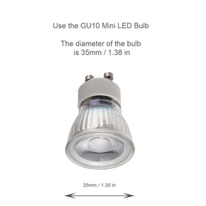 May include: A clear glass GU10 Mini LED bulb with a silver metal base. The bulb is 1.38 inches in diameter.