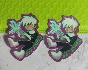 May include: Two stickers featuring a cartoon character with white hair and green eyes, holding a futuristic device with green energy. The character is dressed in a black and white outfit. The stickers have the text "GET SOUPED" in green.