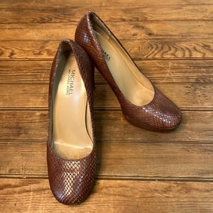 Kors Shoes Michael Kors Ames Pump Buy Michael Kors Olympia Mixed-Media Trainer Pink Color Women AJIO LUXE