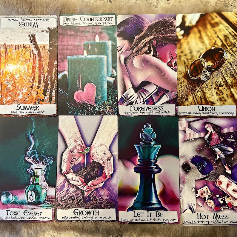 May include: Tarot card deck with ten cards spread out on a table. The cards are colorful and feature various images, including a heart, a couple hugging, a ring, a bottle of potion, a plant growing, a chess piece, and a messy scene. The cards have text on them, including "Divine Counterpart", "Summer", "Forgiveness", "Union", "Toxic Energy", "Growth", "Let It Be", and "Hot Mess".