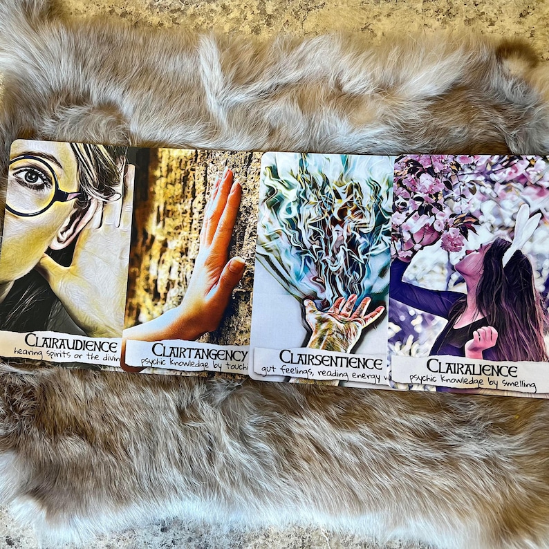 May include: Four colorful cards with different psychic abilities: Clairaudience, Clairtangency, Clairsentience, and Clairalience. Each card has a unique image and a description of the ability.