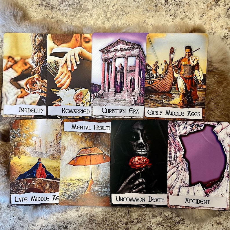 May include: A set of ten tarot cards with colourful illustrations and text. The cards depict various scenes, including a couple embracing, a building with columns, a boat with people on it, a woman in a cloak, a skull with a rose, and a broken window.