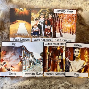 May include: A set of tarot cards with colourful images and text. The cards include images of a road, a family, a forest, a city street, a person with a lantern, a woman with fire, and a bird with leaves. The text on the cards includes "Start", "First Lifetime", "Many Children", "Warm Climate", "Cold Climate", "Western Europe", "Sudden Sickness", "Long-Term Illness", "Air", "Earth", "Water", and "Fire".