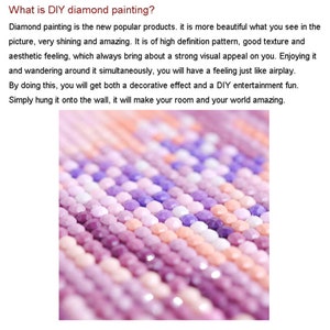 May include: Close-up of a diamond painting kit with pink, purple, and white diamond-shaped beads. The beads are arranged in rows and create a textured pattern.
