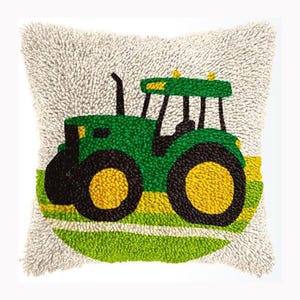 May include: A square throw pillow with a textured, off-white tufted background. The center features a punch needle design of a green tractor with large black wheels, yellow rims, and a black exhaust pipe, set against a green and yellow striped field.