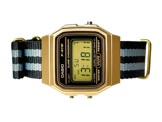 Reloj Casio dorado personalizado con correa negra/gris -  España