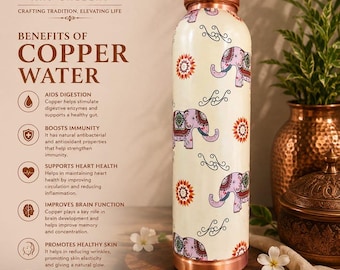 May include: A copper water bottle with a cream-colored body, adorned with purple elephant and floral designs. The bottle has a copper top and base. The text on the bottle reads "Benefits of Copper Water".