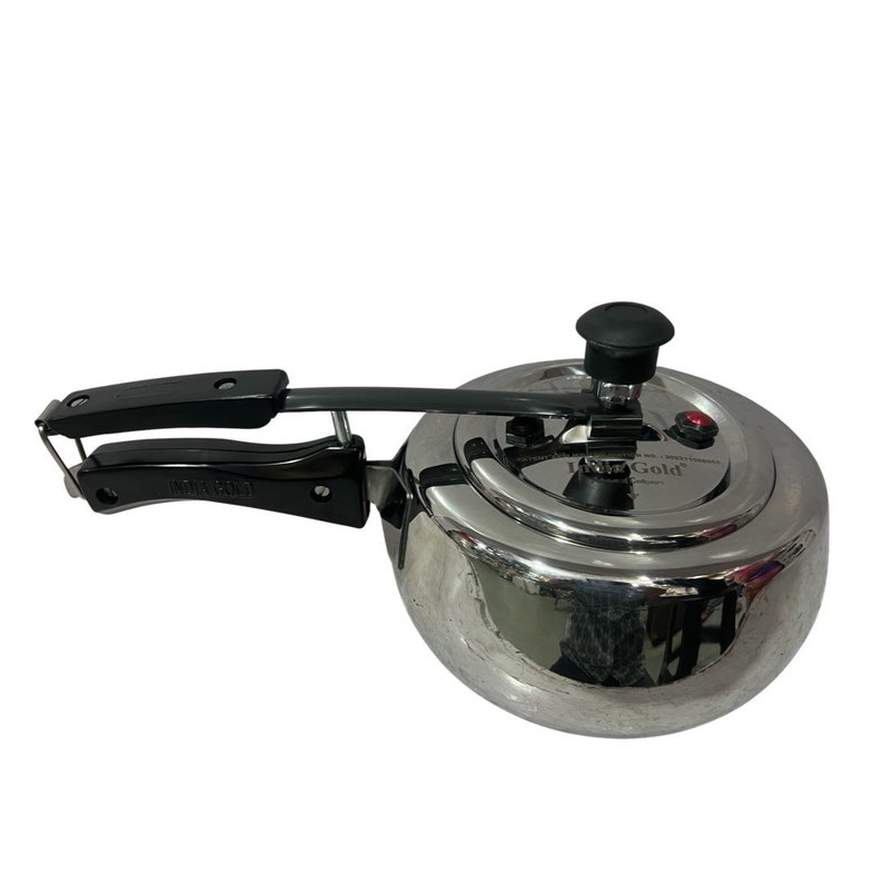 May include: A silver pressure cooker with a black handle and a black knob on the lid. The lid has a red button and the text "Ultra Gold" printed on it.