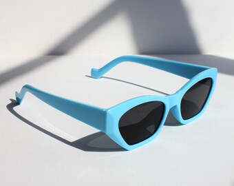 turquoise frame sunglasses