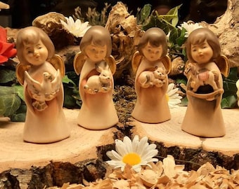 Decorative wooden angels with various motifs/ guardian angels/ message angels/ love/ wedding/ baptism/ communion/ angel series