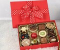 Red Festive Chocolate Box. 12 Luxury Belgian Chocolates in a Red Box with Christmas Star Ribbon. A Perfect Festive Present For Him & Her