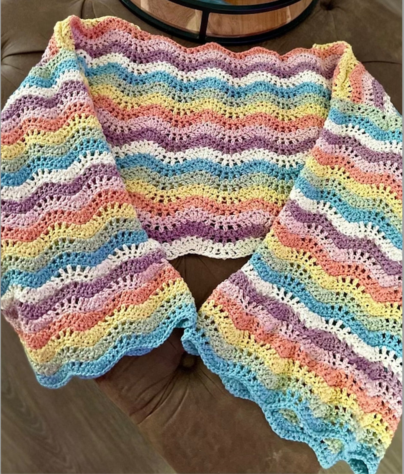A rainbow-colored sweater. The stripes are wavy.