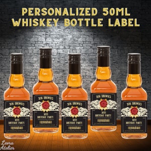 May include: Five 50ml whiskey bottles with personalized labels. Each label features a black background with gold accents, a vintage design, and the text "Jon Brown's 30th Birthday Party".