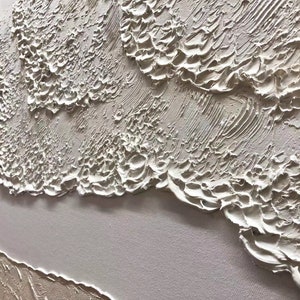 May include: Abstract painting with a textured, white and cream color palette. The paint is applied in thick layers, creating a three-dimensional effect.
