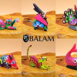 May include: A set of six colorful wooden animal figurines, each with intricate details and vibrant paint. The animals include a cat, a peacock, a fish, a pig, a jaguar, and a tapir. The figurines are hand-painted and feature a variety of colors, including pink, green, blue, yellow, and red.