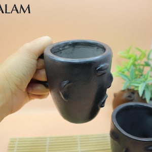 Barro Negro Tea or Coffee mug with face. Coffee Mug, Taza de Barro negro, Barro negro cup. Rustic handmade Mugs. San Bartolo, Oaxaca.