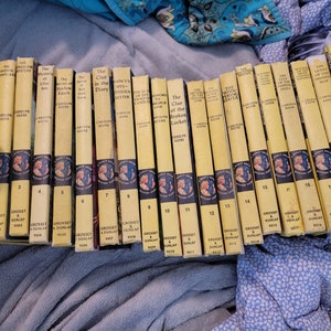 Nancy Drew Mystery Stories - vintage yellow matte - inside cover art in white or blue