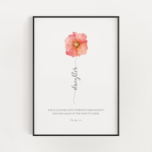 May include: A watercolor print with a pink flower and the text "daughter" and a bible verse: "She is clothed with strength and dignity, she can laugh at the days to come. (Proverbs 31:25)"