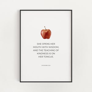 May include: A printable quote about kindness with a red apple illustration. The quote reads "She opens her mouth with wisdom, and the teaching of kindness is on her tongue." Proverbs 31:26