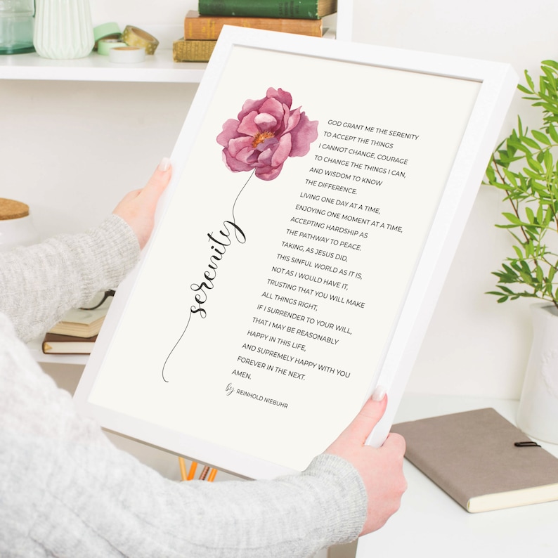 May include: A printable wall art print with a pink flower and a white background. The print features a poem titled "Serenity" by Reinhold Niebuhr. The poem is about accepting the things you cannot change, having the courage to change the things you can, and the wisdom to know the difference.