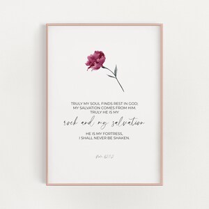 May include: A watercolor painting of a pink flower with a quote from Psalm 62:1-2: "Truly my soul finds rest in God; my salvation comes from him. Truly he is my rock and my salvation. He is my fortress, I shall never be shaken."