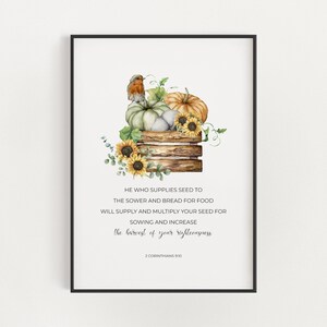 May include: A watercolor illustration of a wooden crate filled with pumpkins, sunflowers, and a robin. The quote "He who supplies seed to the sower and bread for food will supply and multiply your seed for sowing and increase the harvest of your righteousness." is printed below the image. The quote is attributed to 2 Corinthians 9:10.
