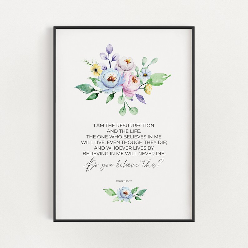 May include: A framed print featuring a watercolor floral arrangement in pastel colors. The artwork includes text from John 11:25-26, with the question "Do you believe this?" written in cursive. The frame is black.