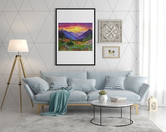 May include: A light blue sofa with a throw blanket, two cushions, and a coffee table with books and a succulent plant. The sofa is in front of a white wall with a black geometric pattern. There is a framed landscape painting and two framed decorative pieces on the wall.