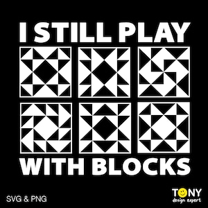May include: Black square design with the text "I STILL PLAY WITH BLOCKS" in white. The design includes six square quilt block patterns in black and white. The bottom left corner says "SVG & PNG" and the bottom right corner has a logo.