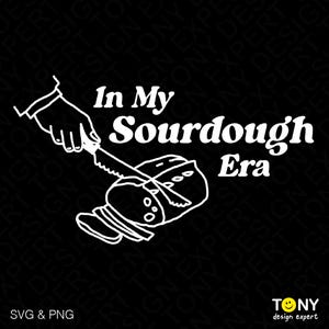 May include: A black and white illustration of a hand slicing a loaf of sourdough bread with the text "In My Sourdough Era".