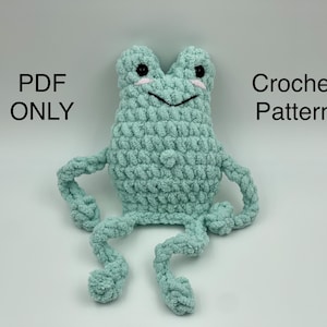 Puede incluir: Un patrón de crochet para una rana verde con ojos negros y una sonrisa blanca. El patrón está disponible para descargar en PDF. PDF ONLY Crochet Pattern