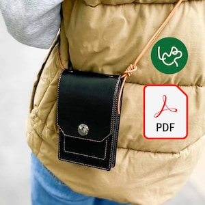 May include: A black leather crossbody bag with a flap closure and a single button. The bag is worn over a brown quilted vest and blue jeans.