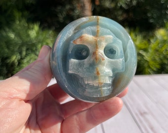 Lemurian blue calcite sphere skull