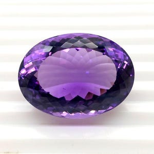 70.50 Carat Oval Amethyst Gemstone: Faceted Brazilian Lotus Cut