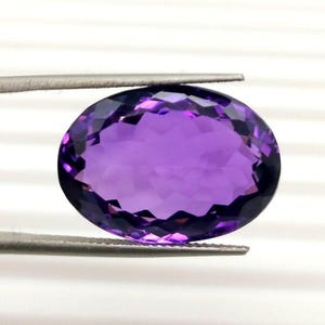 20 Carat Oval Brazilian Amethyst Gemstone: Faceted Purple Stone (15x21x14 MM)
