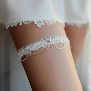 Italian lace wedding garter for bride with crystal danglings, Adjustable light ivory lace garter for wedding, Fancy silver bridal garter
