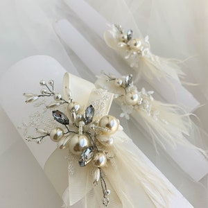 White unity candles with ivory and golden embellishment, White wedding candles set with taper and pilar candles, decorated with ostrich feathers and pearls
