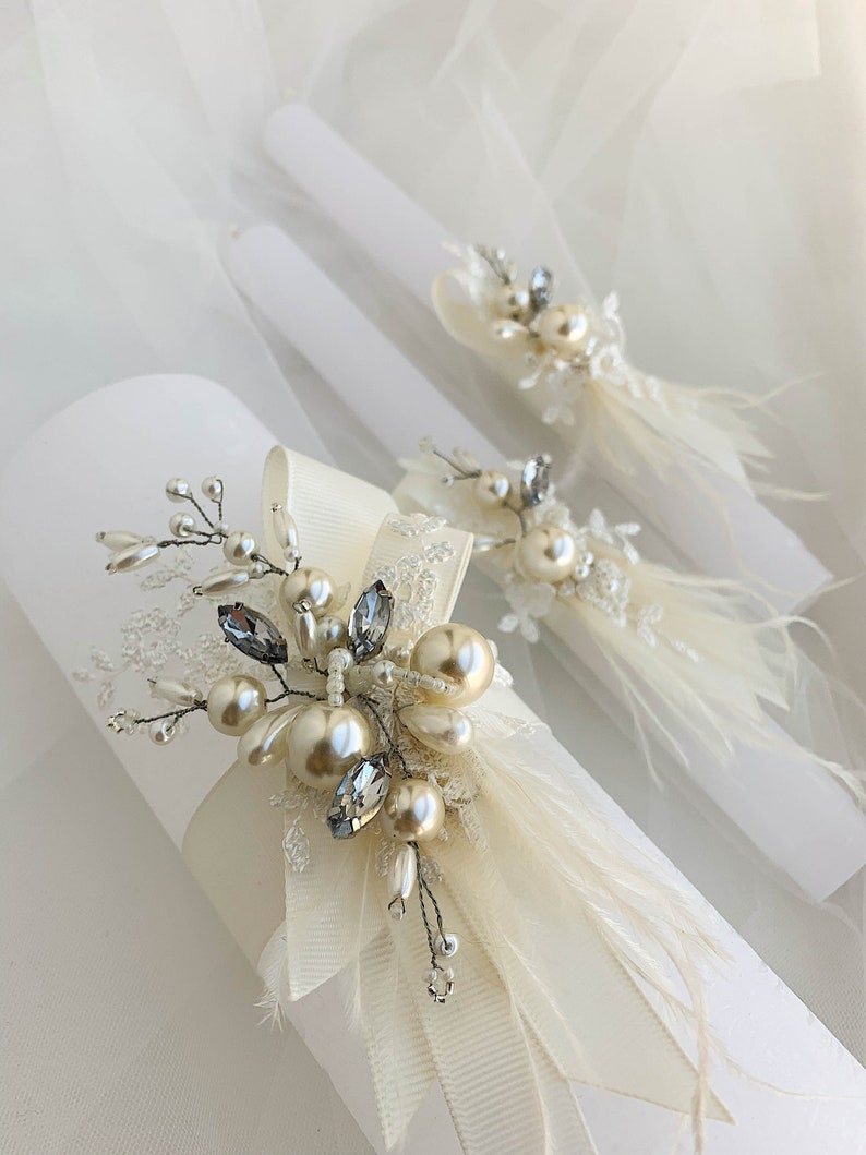 White unity candles with ivory and golden embellishment, White wedding candles set with taper and pilar candles, decorated with ostrich feathers and pearls