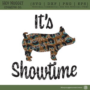 May include: It's Showtime text with a brown and teal leopard print pig silhouette. The text is in black.