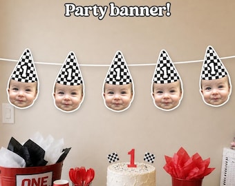 May include: A party banner featuring five cutouts of a baby's face wearing a black and white checkered party hat with the number 1 printed on it. The banner is strung on a white cord. The text Party banner! is displayed above the banner.
