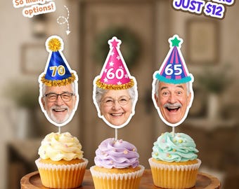 May include: Three cupcakes topped with personalized face cutouts wearing party hats featuring the numbers 70, 60, and 65. Text on the image reads: So many hat options! and 24 TOPPERS JUST $12. The cupcakes have yellow, purple, and light blue frosting.