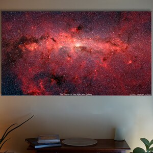 May include: A vibrant red and black image of the center of the Milky Way galaxy. The image is filled with stars and nebulae, creating a stunning display of cosmic beauty. The text "The Center of the Milky Way Galaxy" is visible at the bottom of the image.